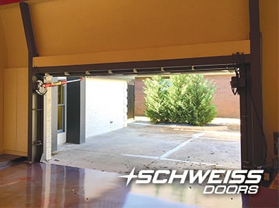 Glass Designer Hydraulic Garage Door matches the immaculate flooring