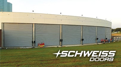 music factory's seven schweiss bifold liftstrap doors wrap-around the building's 10.5 degree curve to it