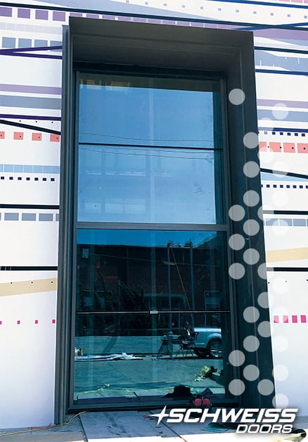 Schweiss Bifold Liftstrap Door allows companies to bring large objects into workplace
