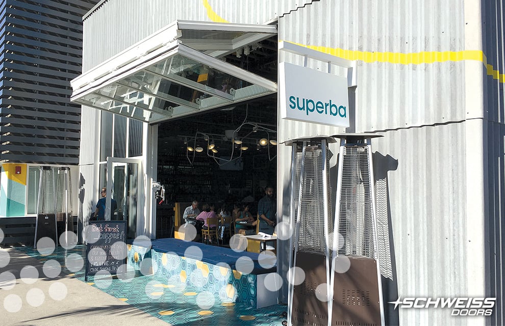 Superba Food + Bread has a Schweiss Bifold Glass Door at the front of the Restaurant