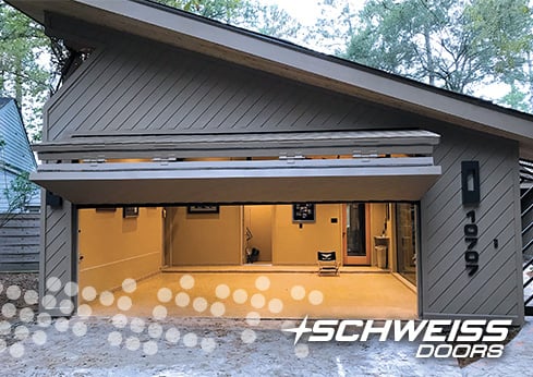 Schweiss bifold door is clad to match garage exterior