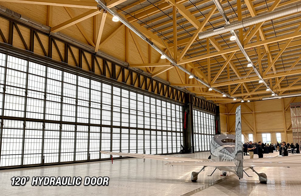 120ft Schweiss Hydraulic Door fitted on hangar with smaller plane inside