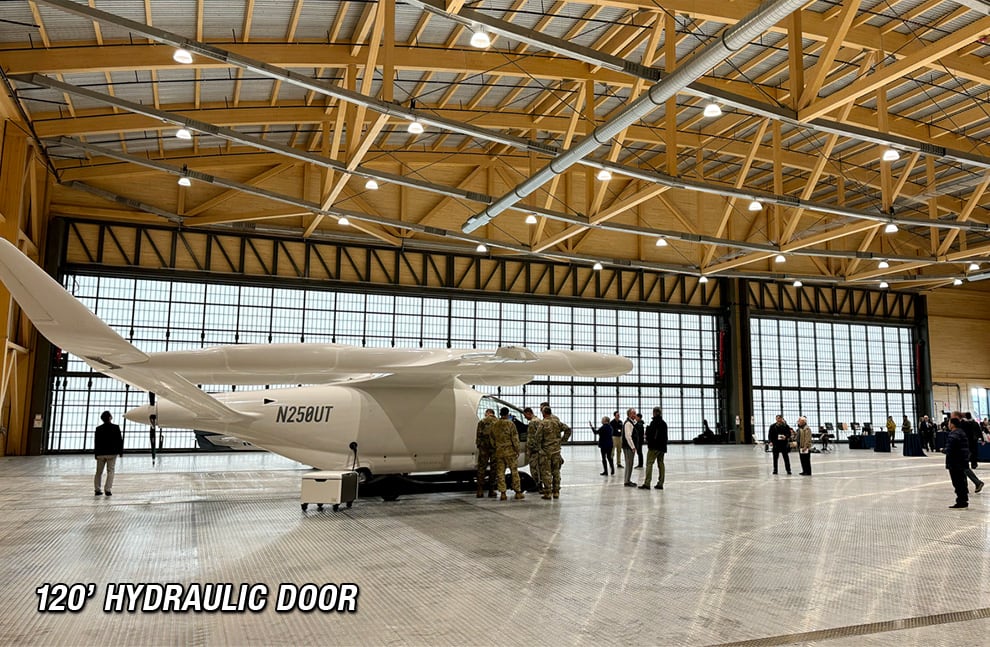 120ft Schweiss Hydraulic Door fitted on hangar with medium sized plane inside