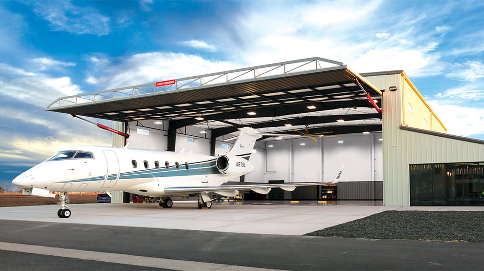 Large Schweiss Hydraulic Door on corporate jet box hangar