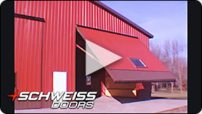 Red Power Hydraulics moving large Schweiss One-Piece Door